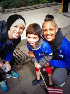 Joanna Lohman and Lianne Sanderson with a young fan