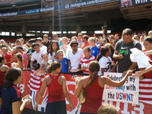 Carli Lloyd and Sydney Leroux sign autographs at RFK on Monday. Photo property of SoccerWire.com