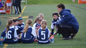 Youth-girls-team-with-coach