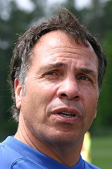 1-bruce-arena Strikers Logo