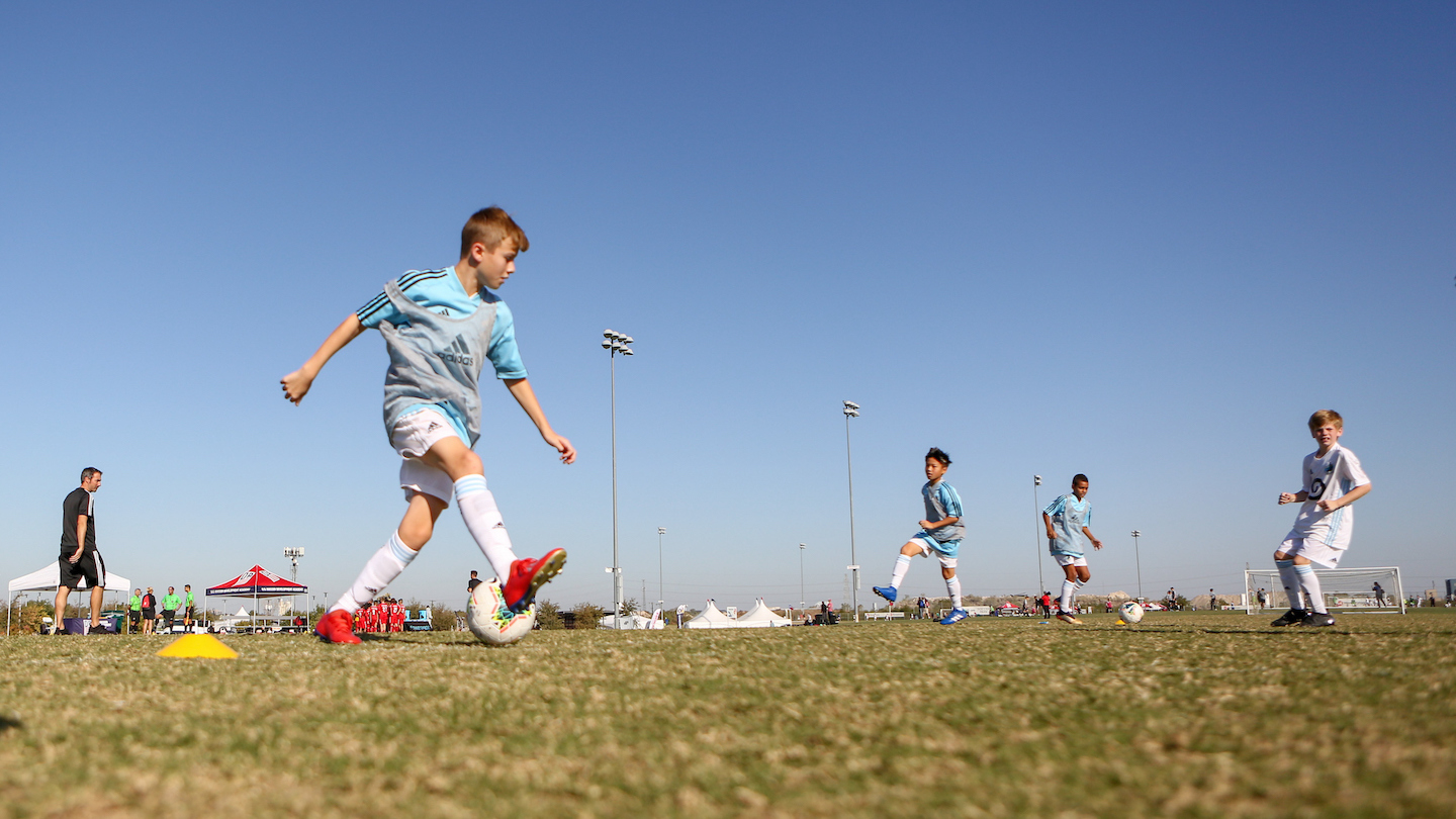 Play tag to give players a fun soccer warm up drill - Soccer Warm